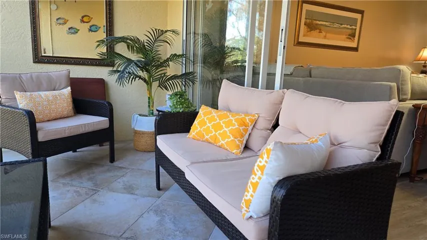 Comfy furniture on lanai with tiled floor and fan