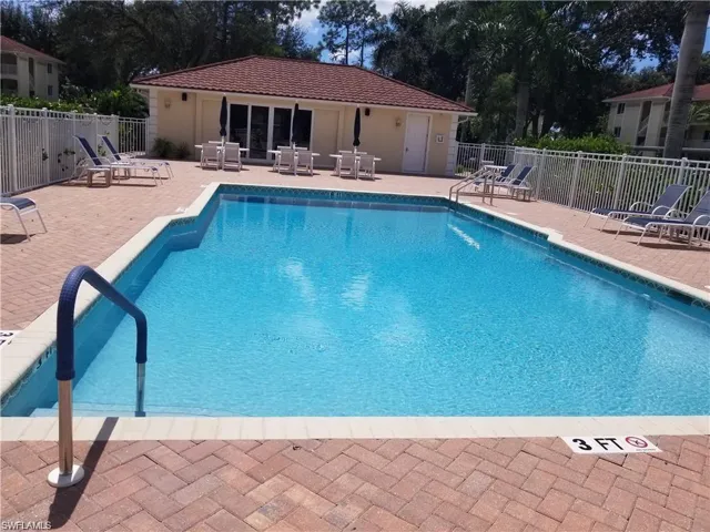 Amberly's heated pool with large deck and plenty of lounge chairs for relaxing
