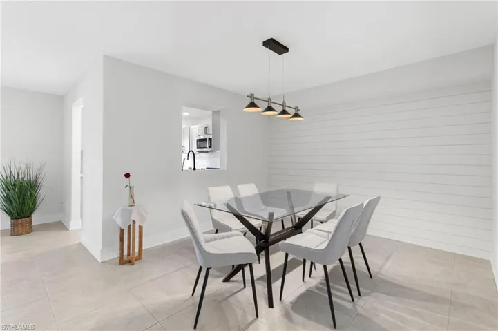 Tiled dining room with sink