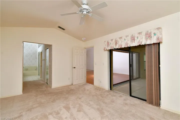 Master BR partial view w/slider door leading to large lanai area; other door leads to bath area
