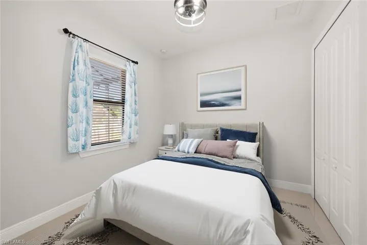 Bedroom with a closet and baseboards