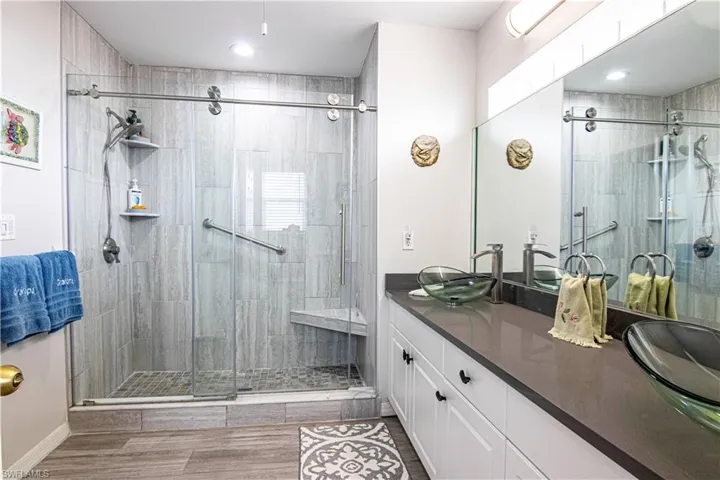 Bathroom featuring vanity and walk in shower