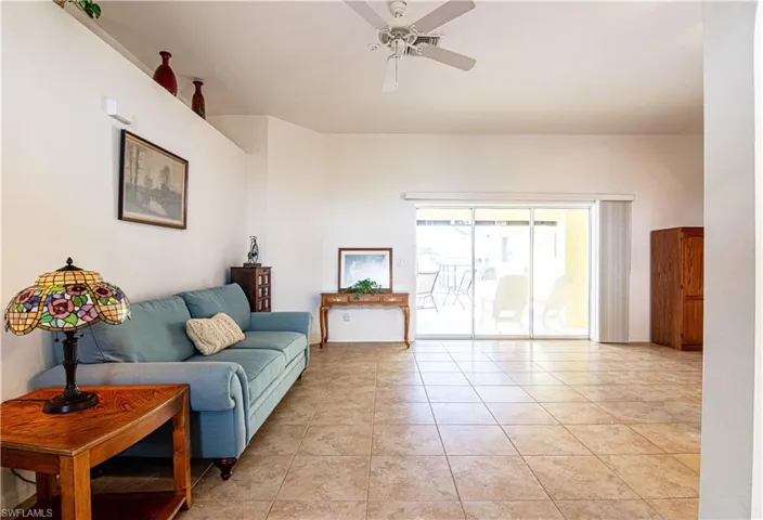 Tiled living room with ceiling fan
