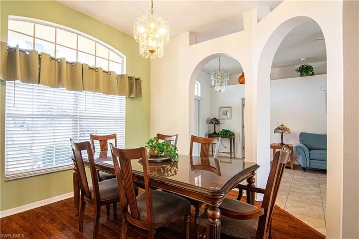 Dining room featuring hardwood / wood-style flooring and an inviting chandelier