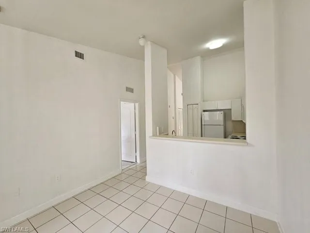 Spare room with light tile patterned floors