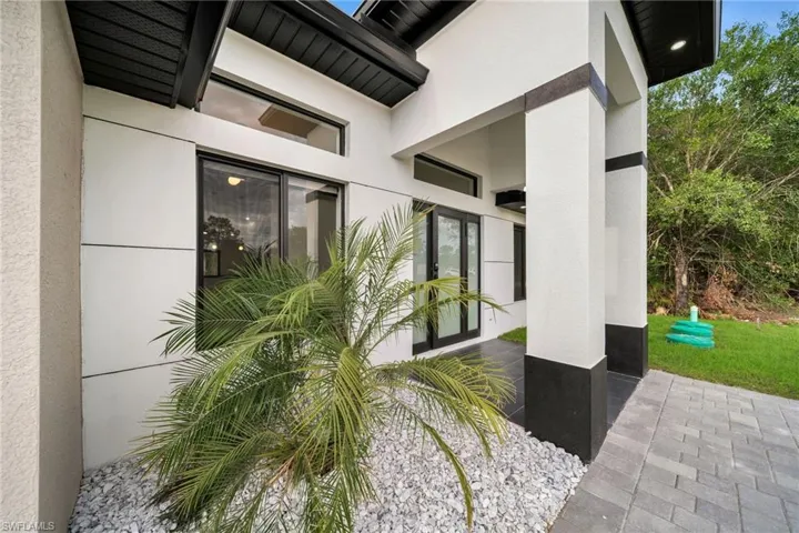 Property entrance with stucco siding