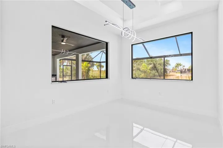 Empty room featuring baseboards
