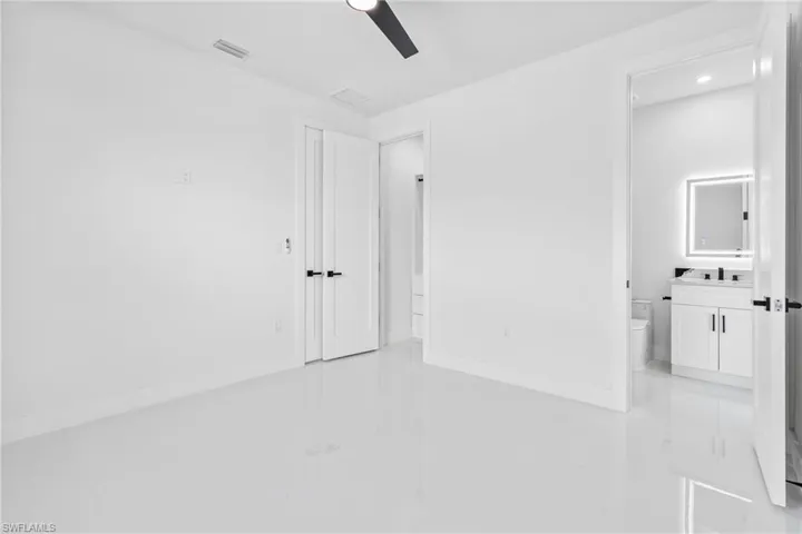 Unfurnished room with light tile patterned floors and recessed lighting