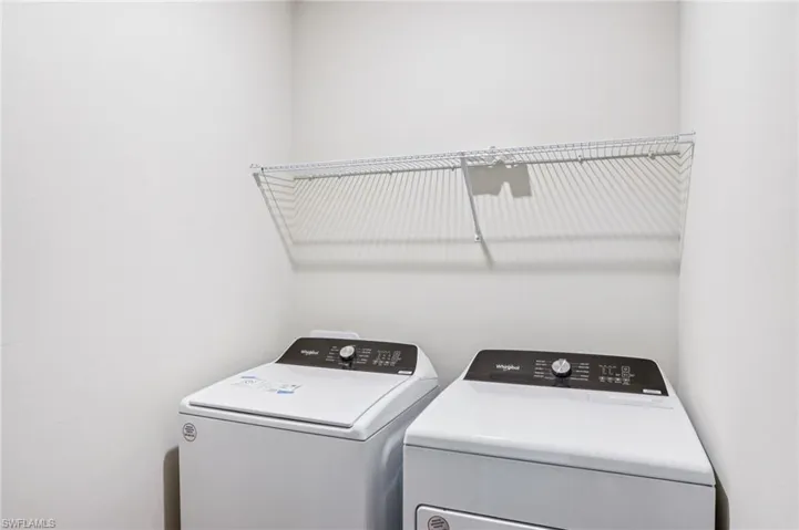 Washroom featuring washer and clothes dryer