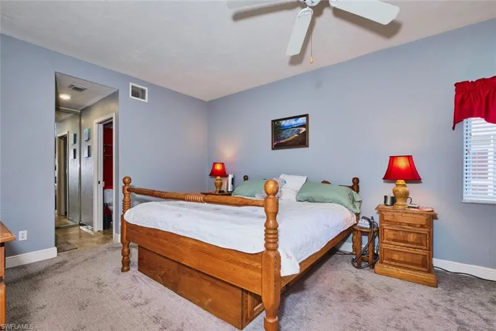 Bedroom featuring a ceiling fan and carpet floors