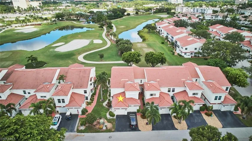 Bird's eye view of a local golf course and a nearby body of water
