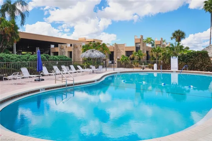 Community pool featuring a patio