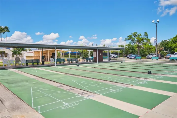 View of home's community featuring shuffleboard