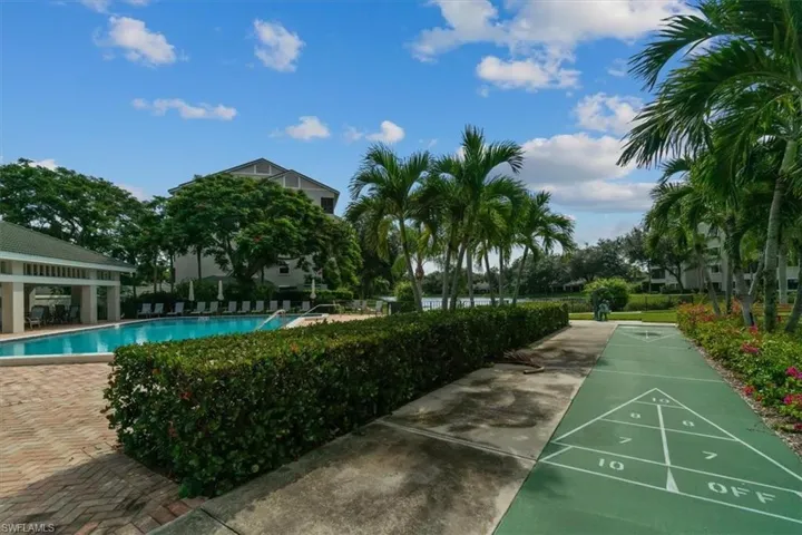 View of home's community with a swimming pool