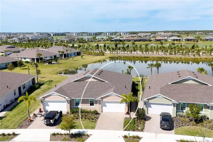 Drone / aerial view overlooking small body of water