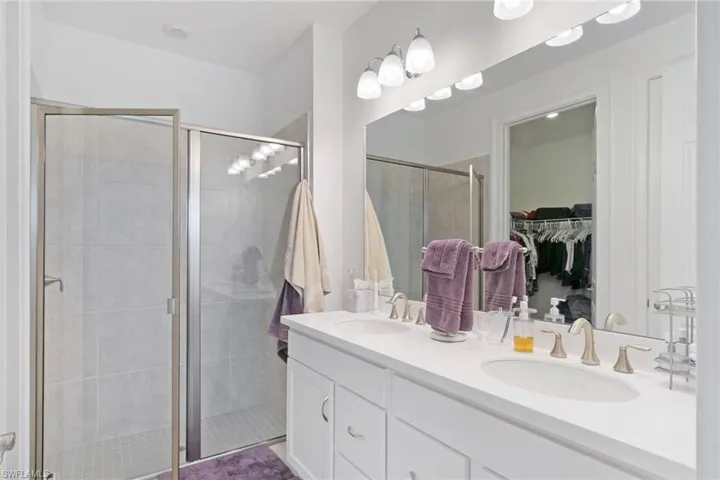 Primary bath with double sinks, a substantial walk in closet, private water closet, spacious shower