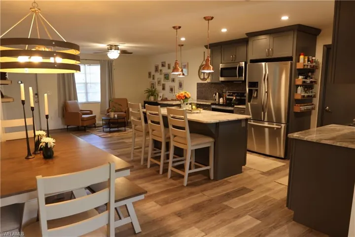 Open-concept living space featuring wood-finish flooring