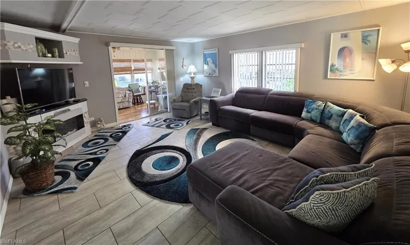 Property conveys TURNKEY, including TVs and fridge in the shed.