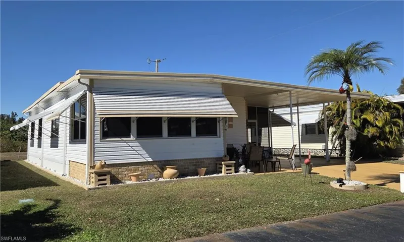 Awnings all around for weather protection and energy savings.
