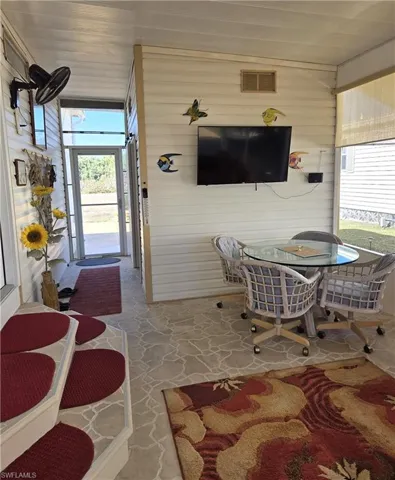 Breezeway leading to one of the sheds and the beautiful backyard.