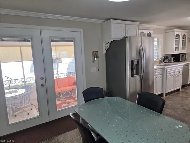Double door entry has built-in adjustable blinds.