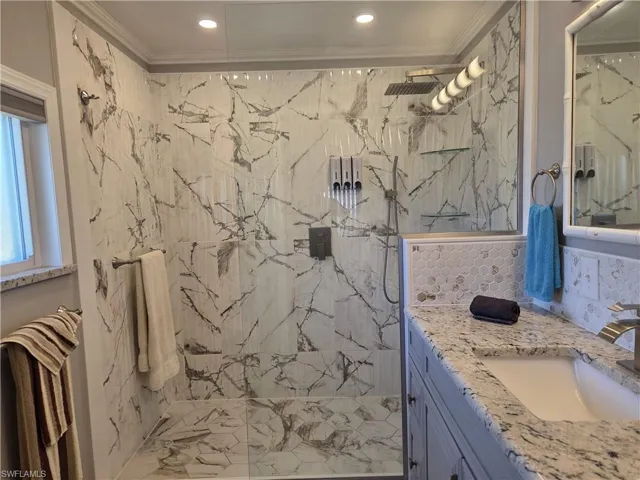 Tile floor in the beautifully upgraded Primary Bath  spacious shower.
