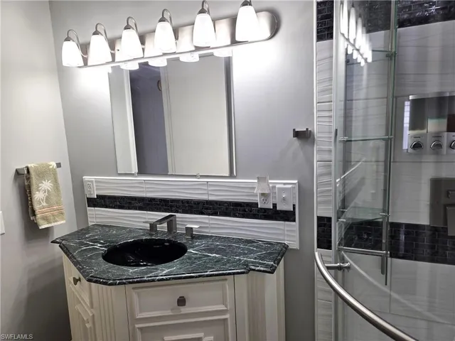 Upgraded lighting, cabinet and shower in the Hall Bath