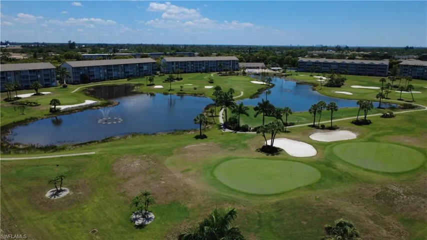 Expansive golf course featuring multiple greens and sand traps