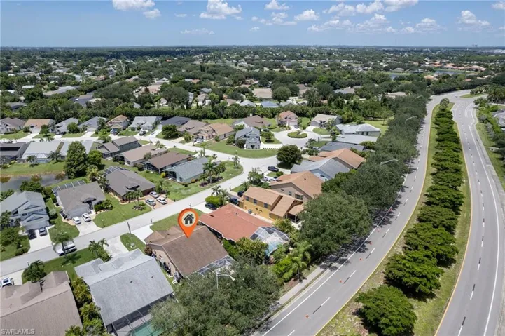 Aerial perspective showcasing a residential neighborhood with established homes and mature landscaping