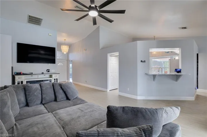 Vaulted ceilings complement the light wood-finish flooring