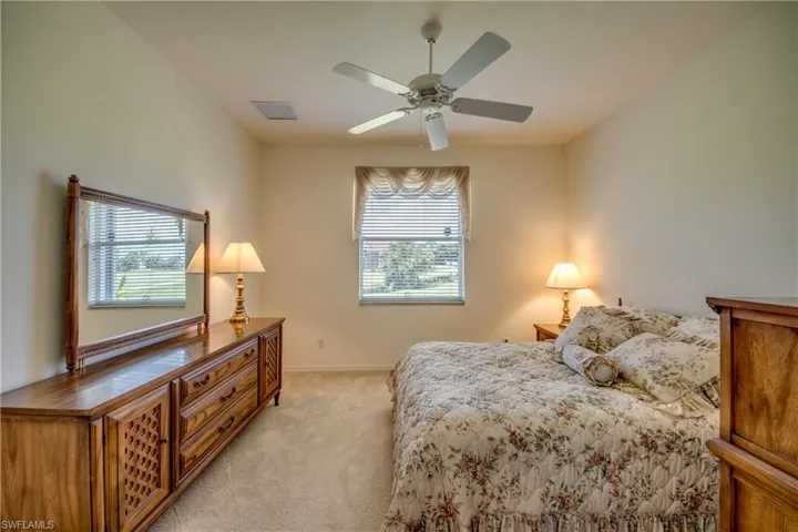 Double door den utilized as bedroom.