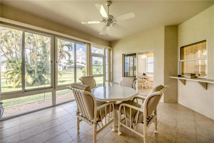 Lanai with sliding door from kitchen nook and also a pass through window for serving convenience.