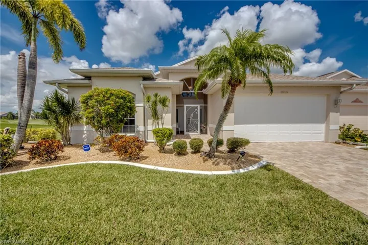 Paver driveway and walk.  Protected with accordion hurricane shutters.