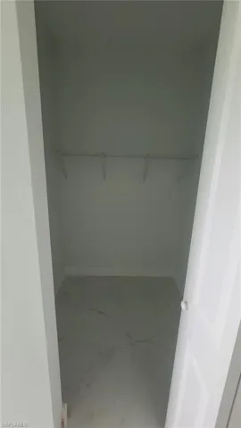 Spacious closet featuring tile patterned floors
