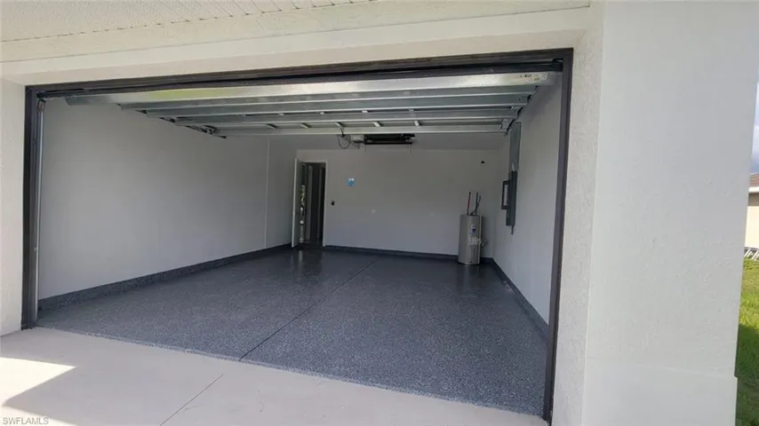 Garage featuring water heater