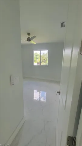 Spare room featuring ceiling fan