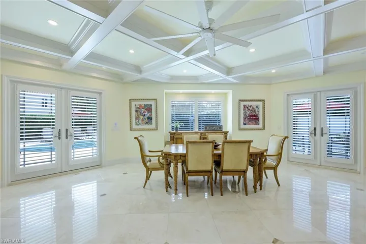 Dining room featuring french doors, coffered ceiling, beam ceiling, recessed lighting, and a ceiling fan