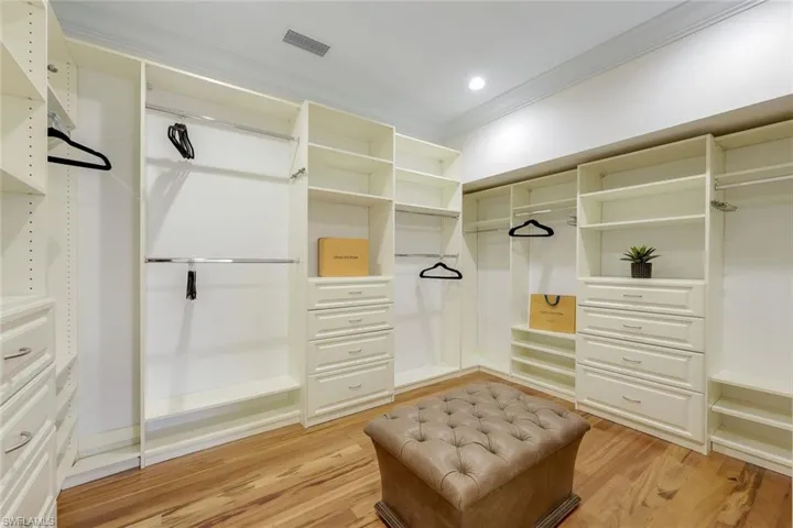 Walk in closet featuring light wood-style flooring