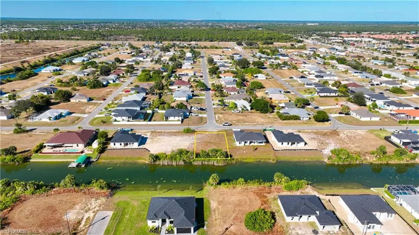 Aerial view of residential area with a nearby body of water