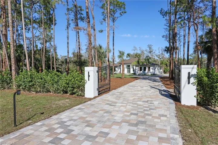 Gated front entry with concrete locking mailbox