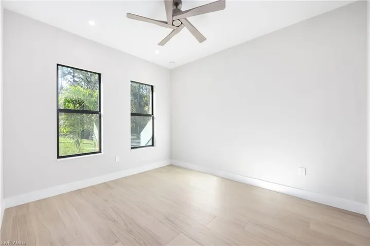 Unfurnished room with ceiling fan, built-in closets and  a wealth of natural light