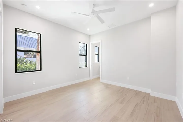 Gusset room with ceiling fan and wood look tile throughout