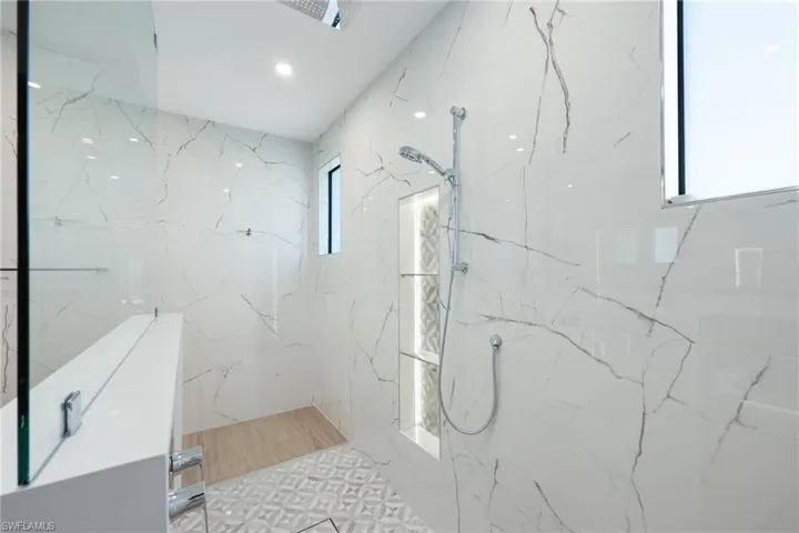 Bathroom featuring tiled shower