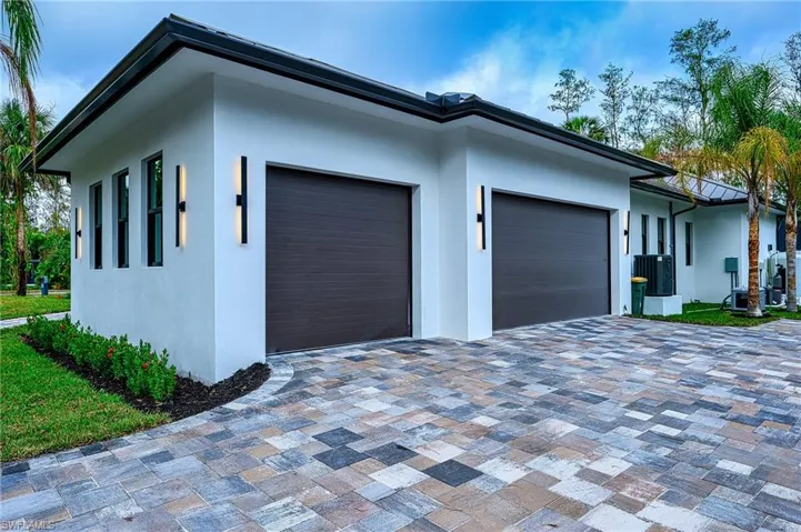 View of side of home featuring a garage