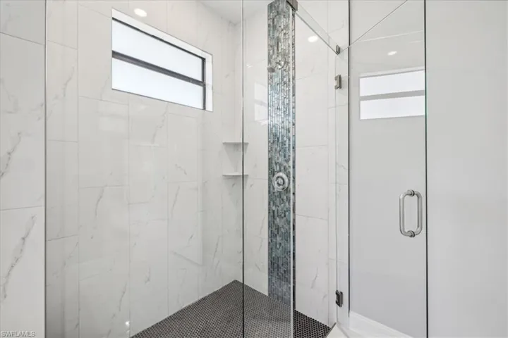 Bathroom with a shower with door