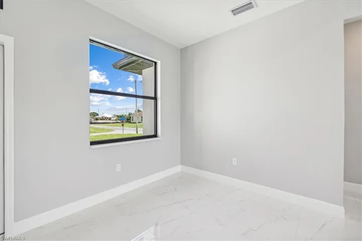 Spare room featuring tile patterned floors