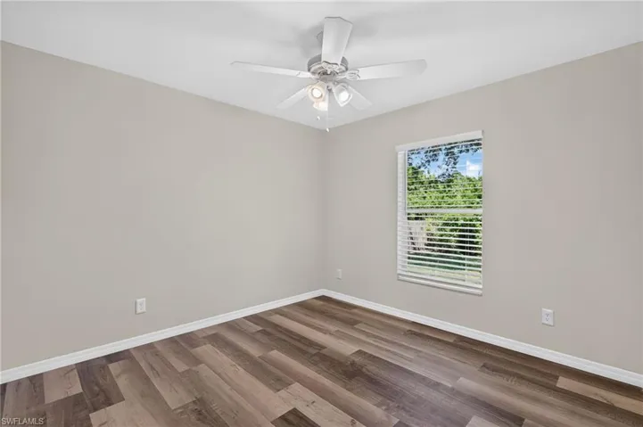 Neutral-toned walls complement wood-finish flooring