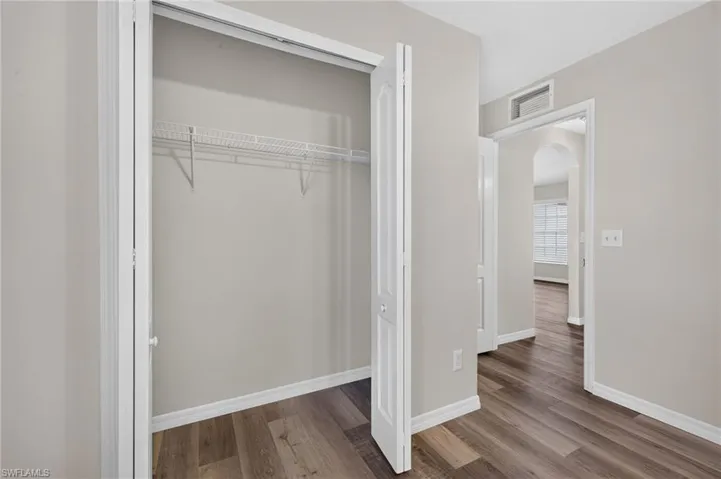 Wood-finish flooring throughout, with neutral wall paint