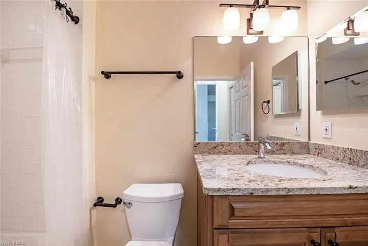 Bathroom with vanity and toilet