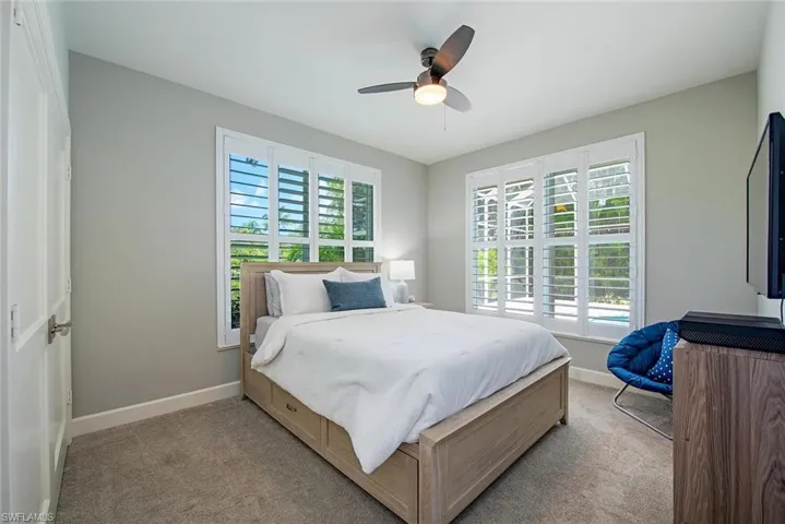 Bedroom with carpet floors and ceiling fan